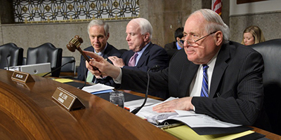 Sen. Levin seated next to Sen. McCain at a hearing